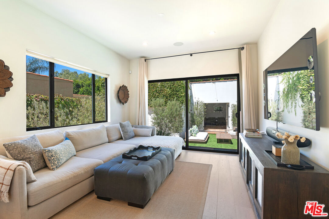 743 North June Street Los Angeles, CA 90038 - Photo 17 of 38 a living room with furniture and a large window