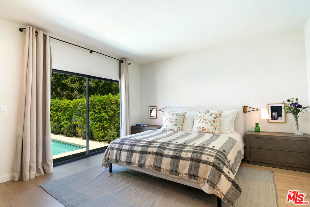 743 North June Street Los Angeles, CA 90038 - Photo 20 of 38 a bedroom with a bed and a large window