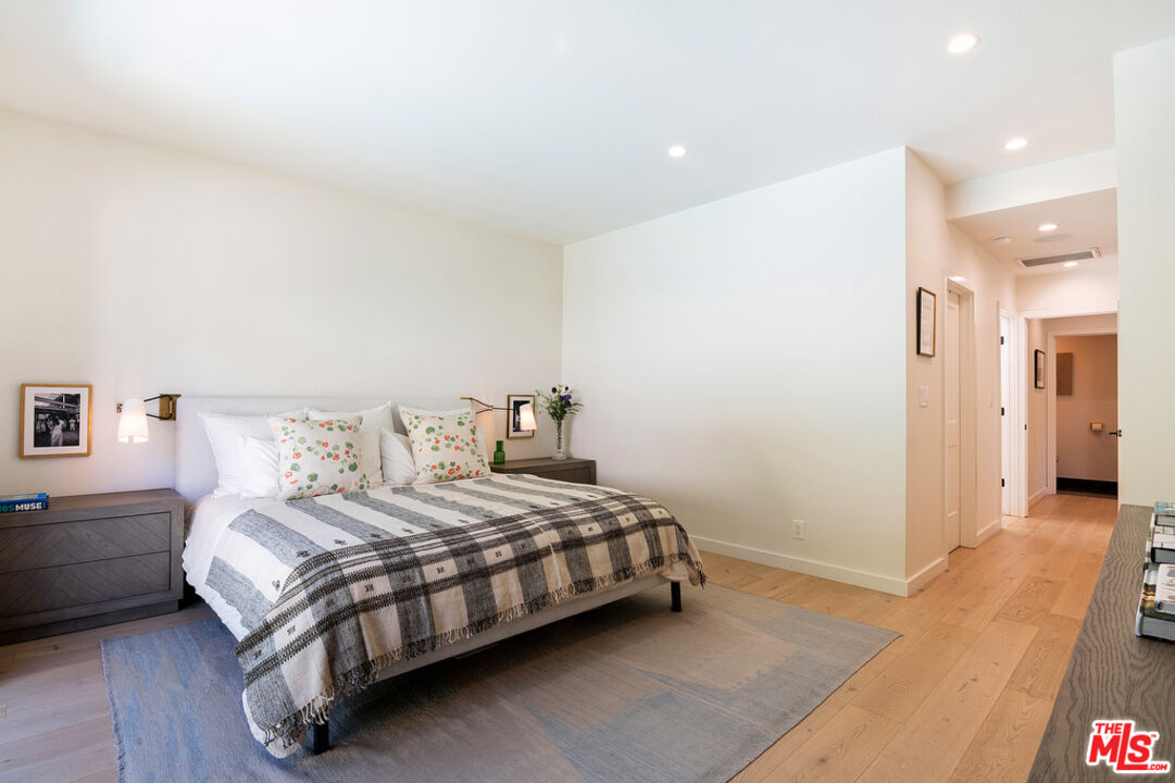 743 North June Street Los Angeles, CA 90038 - Photo 21 of 38 a bedroom with a bed and a table