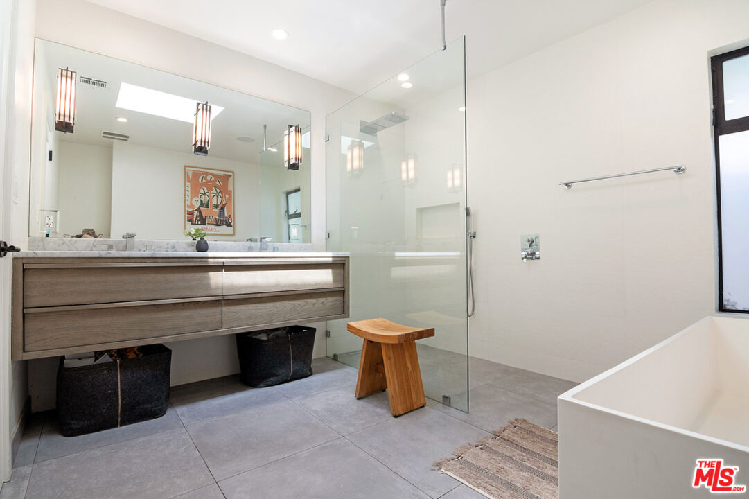 743 North June Street Los Angeles, CA 90038 - Photo 22 of 38 a bathroom with a sink a toilet and shower