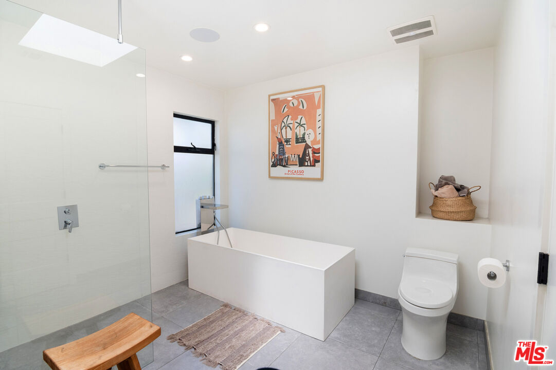 743 North June Street Los Angeles, CA 90038 - Photo 23 of 38 a bathroom with a sink a toilet and shower