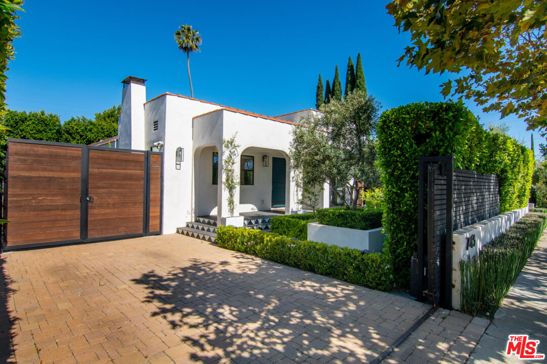 743 North June Street Los Angeles, CA 90038 - Photo 3 of 38 a view of a house with a small yard and potted plants
