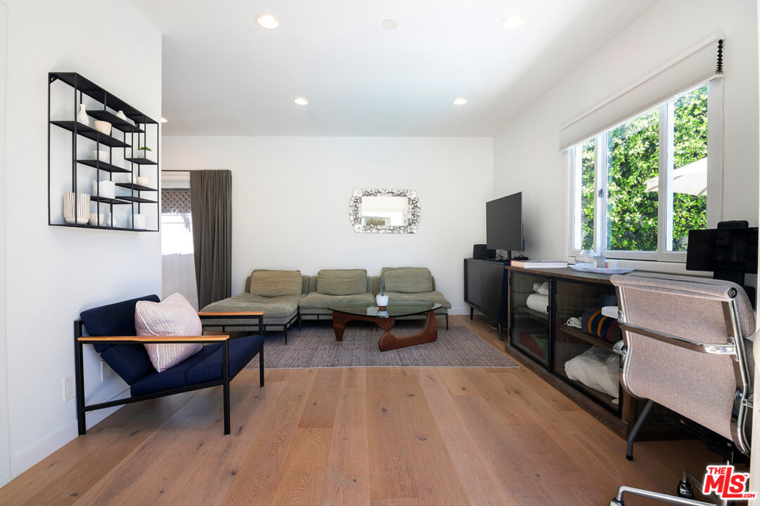 743 North June Street Los Angeles, CA 90038 - Photo 35 of 38 a living room with furniture and a flat screen tv