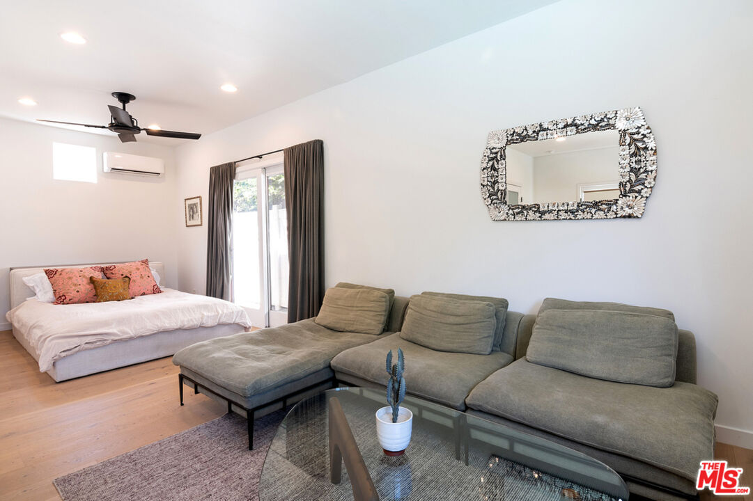 743 North June Street Los Angeles, CA 90038 - Photo 36 of 38 a living room with furniture and a rug