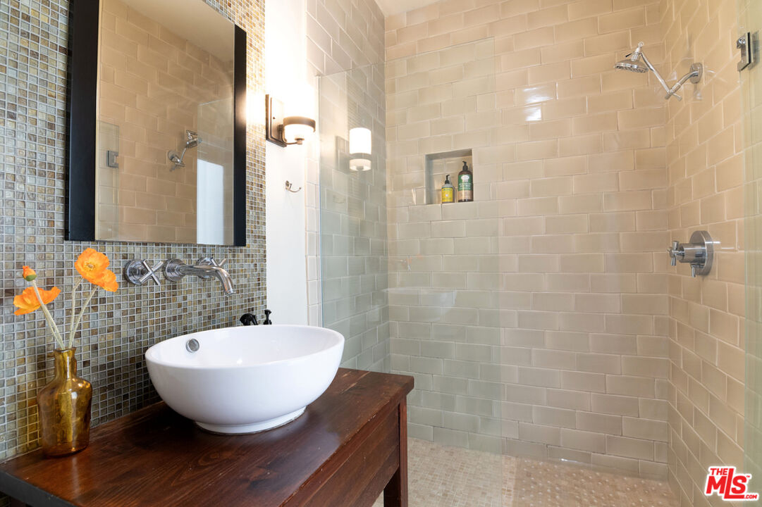 743 North June Street Los Angeles, CA 90038 - Photo 38 of 38 a bathroom with a sink and a mirror