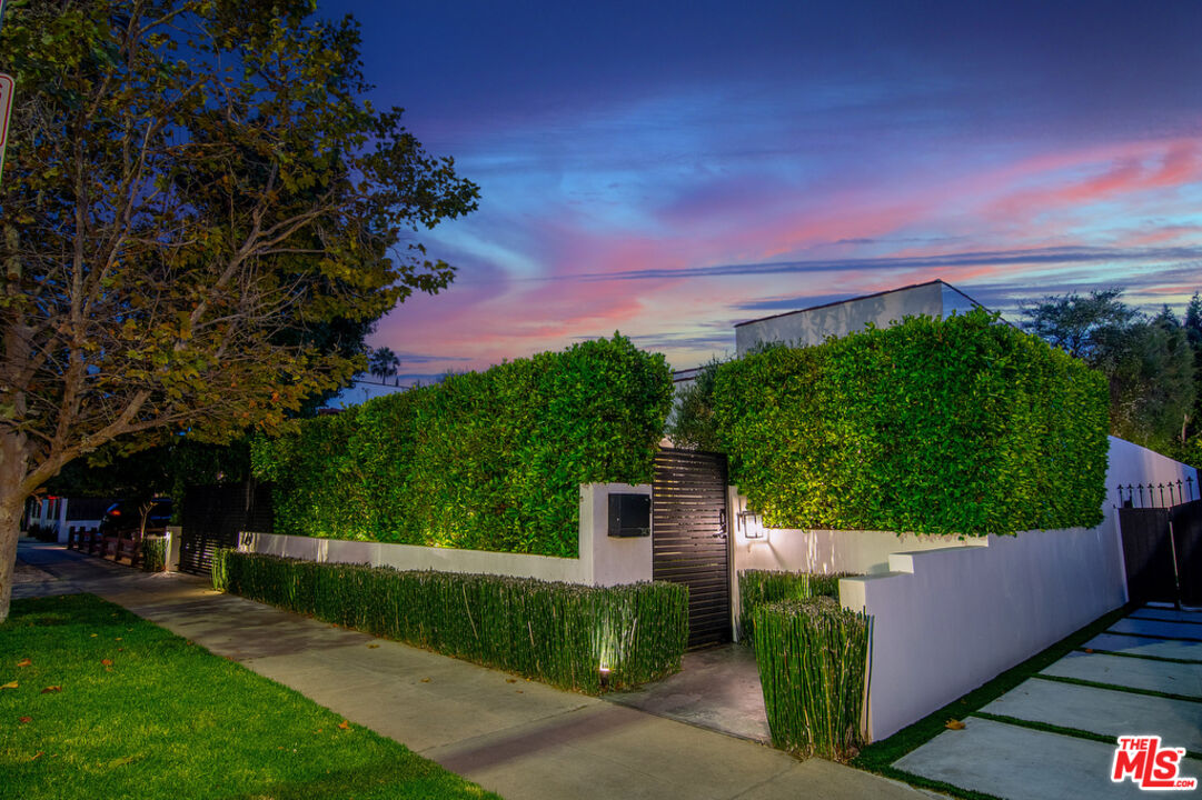 743 North June Street Los Angeles, CA 90038 - Photo 5 of 38 a view of a pathway with a wrought fence