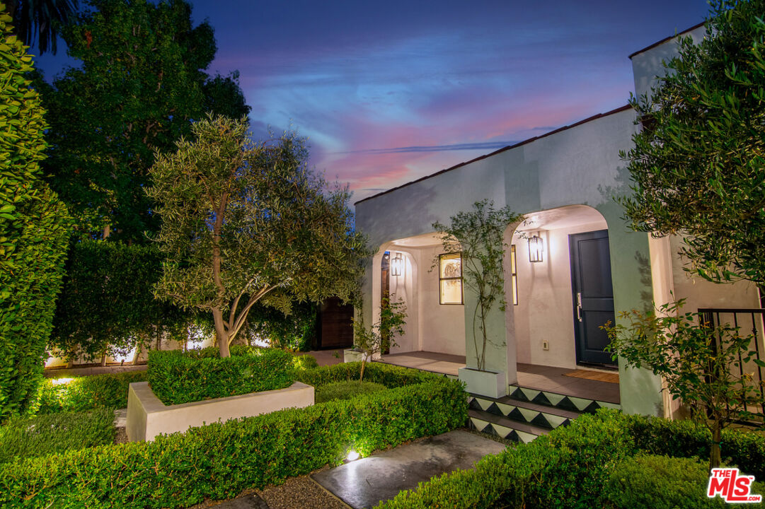 743 North June Street Los Angeles, CA 90038 - Photo 6 of 38 a front view of a house with a yard