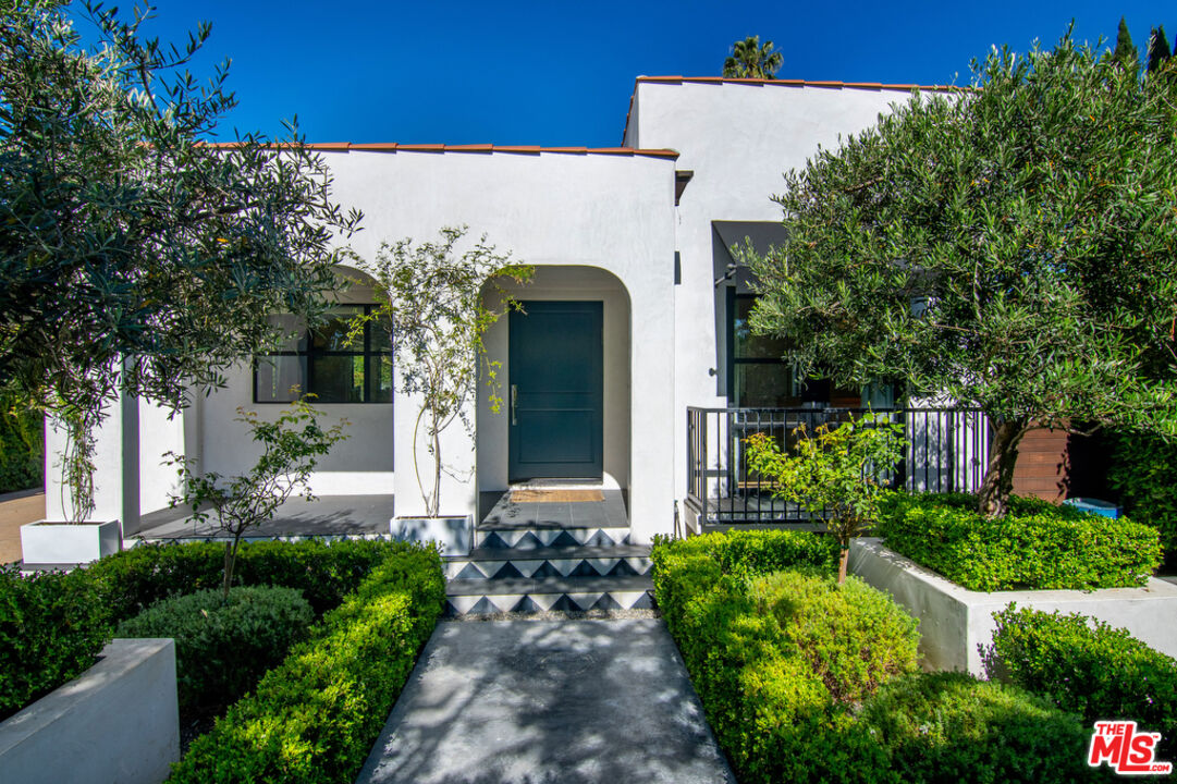743 North June Street Los Angeles, CA 90038 - Photo 7 of 38 a front view of a house with garden