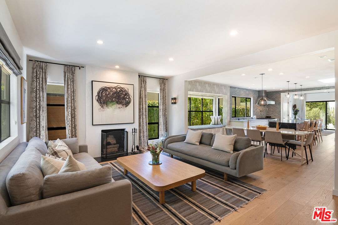 743 North June Street Los Angeles, CA 90038 - Photo 8 of 38 a living room with furniture and a fireplace