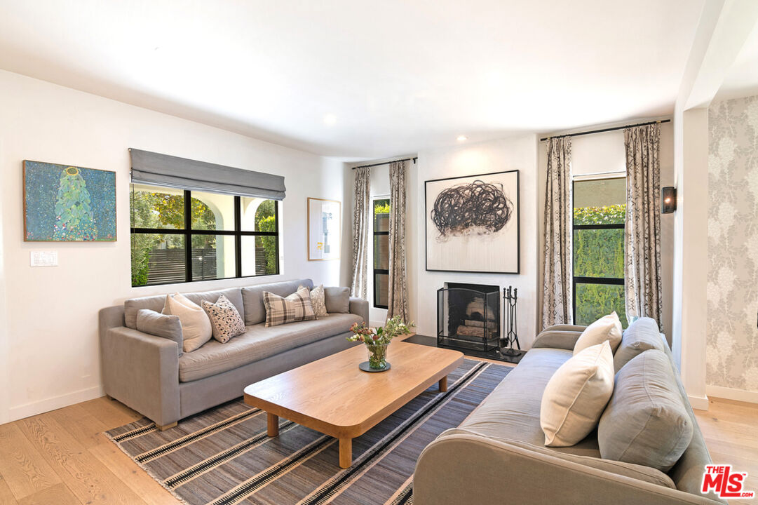 743 North June Street Los Angeles, CA 90038 - Photo 10 of 38 a living room with furniture fireplace and a window