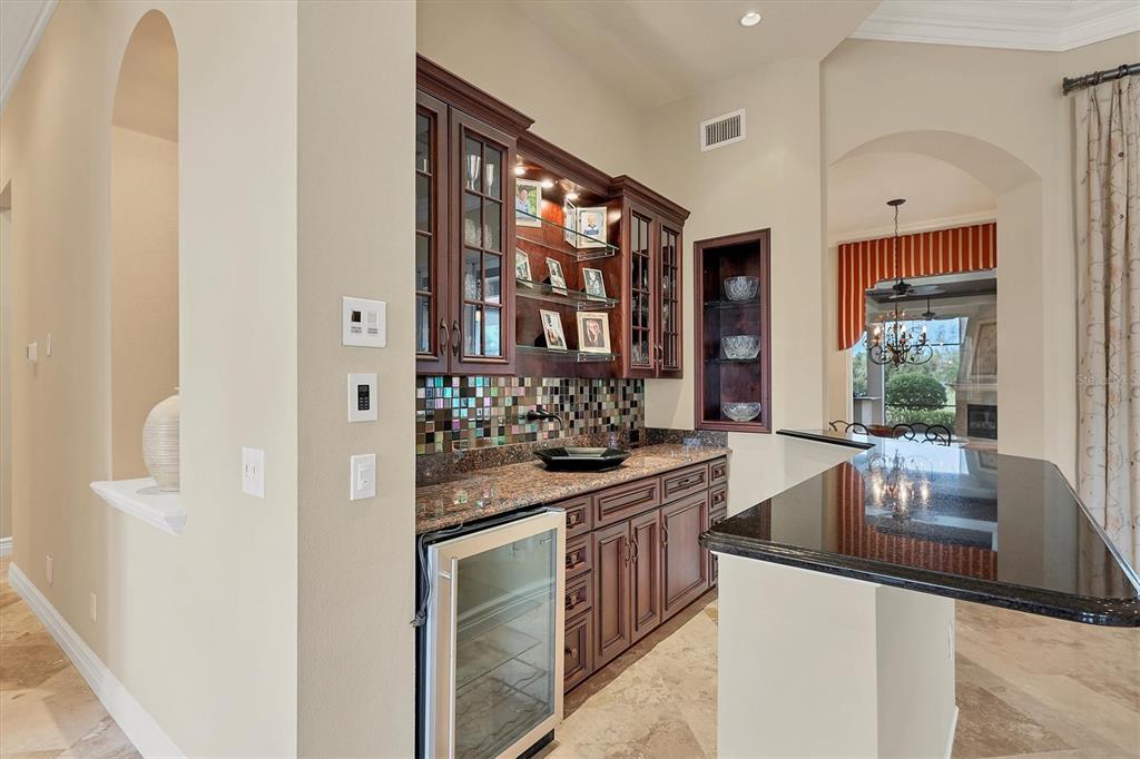7007 Portmarnock Place Lakewood Ranch, FL 34202 - Photo 17 of 92 a kitchen with stainless steel appliances granite countertop a sink and a refrigerator