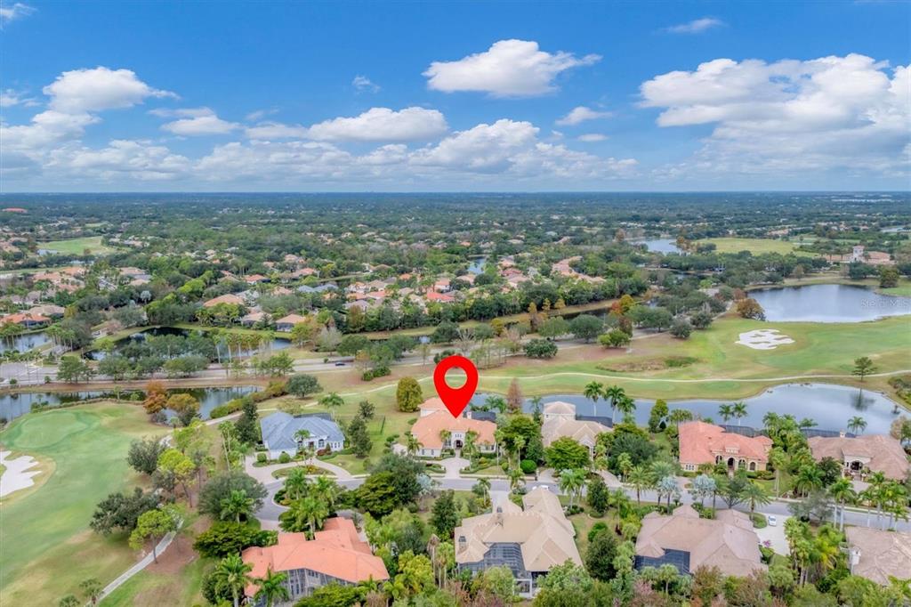 7007 Portmarnock Place Lakewood Ranch, FL 34202 - Photo 2 of 92 an aerial view of residential houses with outdoor space and ocean view