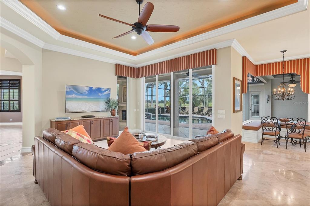 7007 Portmarnock Place Lakewood Ranch, FL 34202 - Photo 29 of 92 a living room with furniture and a large window