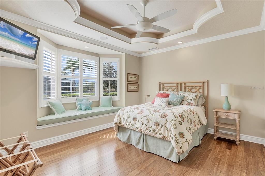 7007 Portmarnock Place Lakewood Ranch, FL 34202 - Photo 46 of 92 a bedroom with a large bed and a large window