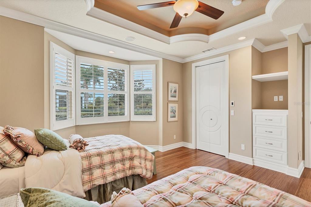 7007 Portmarnock Place Lakewood Ranch, FL 34202 - Photo 51 of 92 a bedroom with a bed and a window
