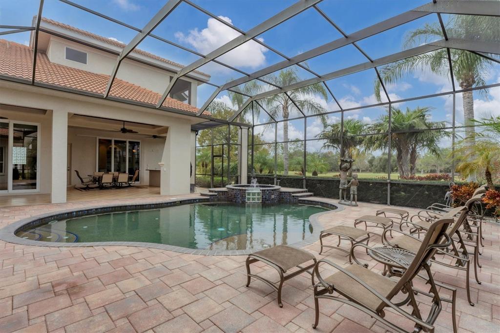 7007 Portmarnock Place Lakewood Ranch, FL 34202 - Photo 66 of 92 a view of a swimming pool with a patio