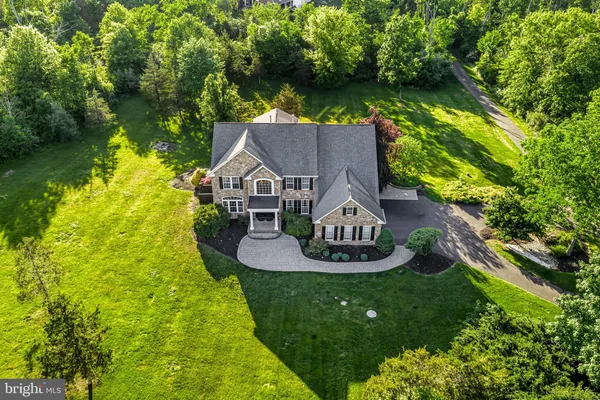 a aerial view of a house with garden space and street view
