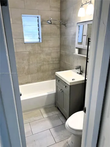 a bathroom with a sink a toilet and a bathtub