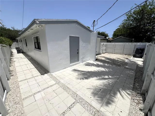 a view of a backyard of the house