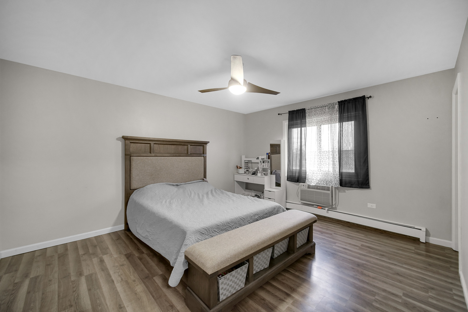 1133 South Finley Road, Unit 310 Lombard, IL 60148 - Photo 12 of 22 a spacious bedroom with a bed and a chandelier