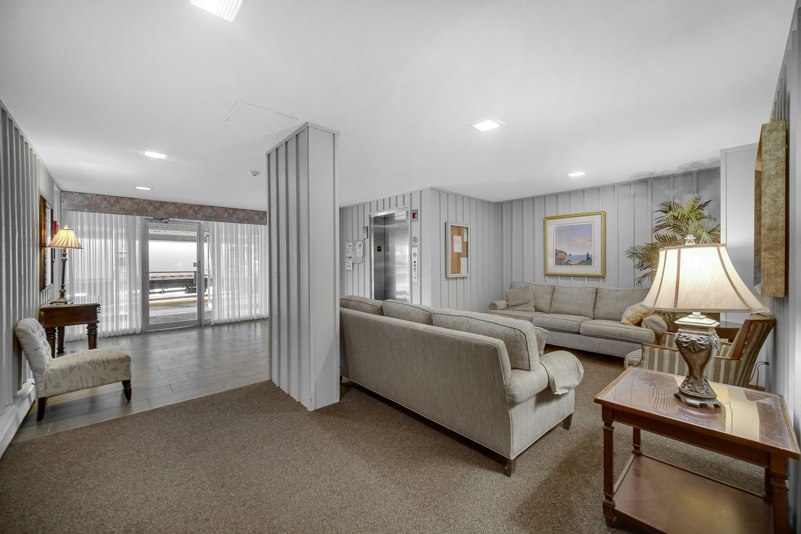 1133 South Finley Road, Unit 310 Lombard, IL 60148 - Photo 16 of 22 a living room with furniture and a flat screen tv