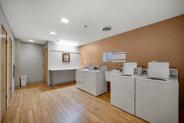 a room with furniture and wooden floor