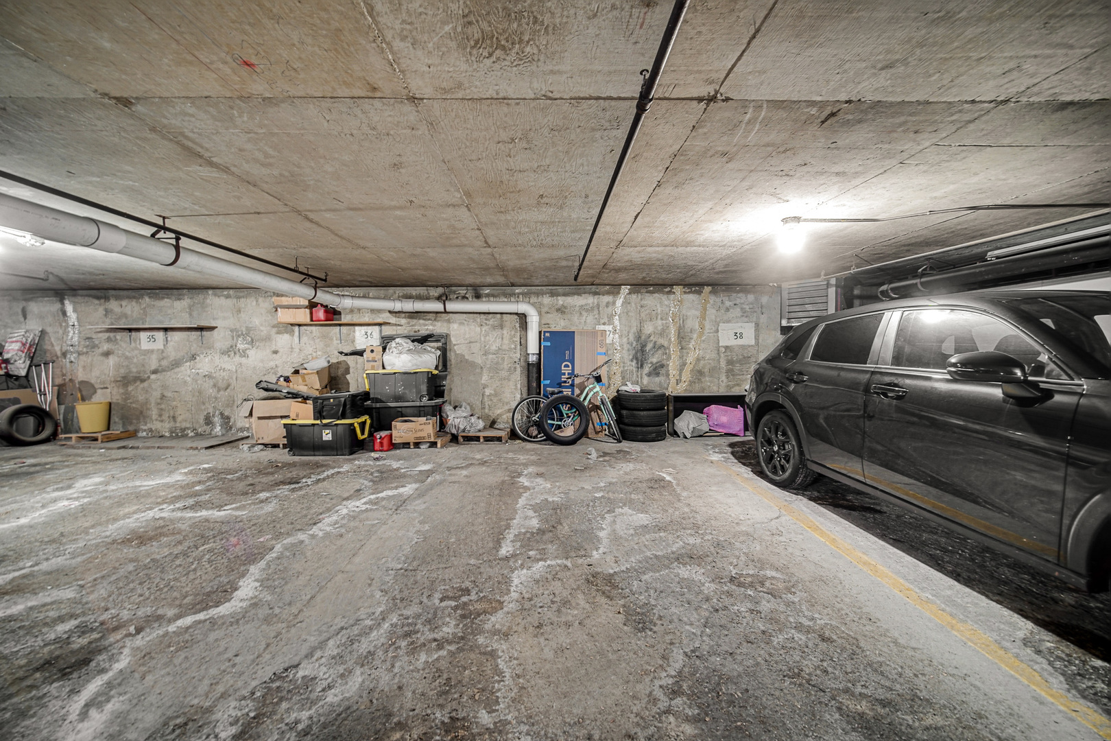1133 South Finley Road, Unit 310 Lombard, IL 60148 - Photo 20 of 22 a view of parking garage with cars