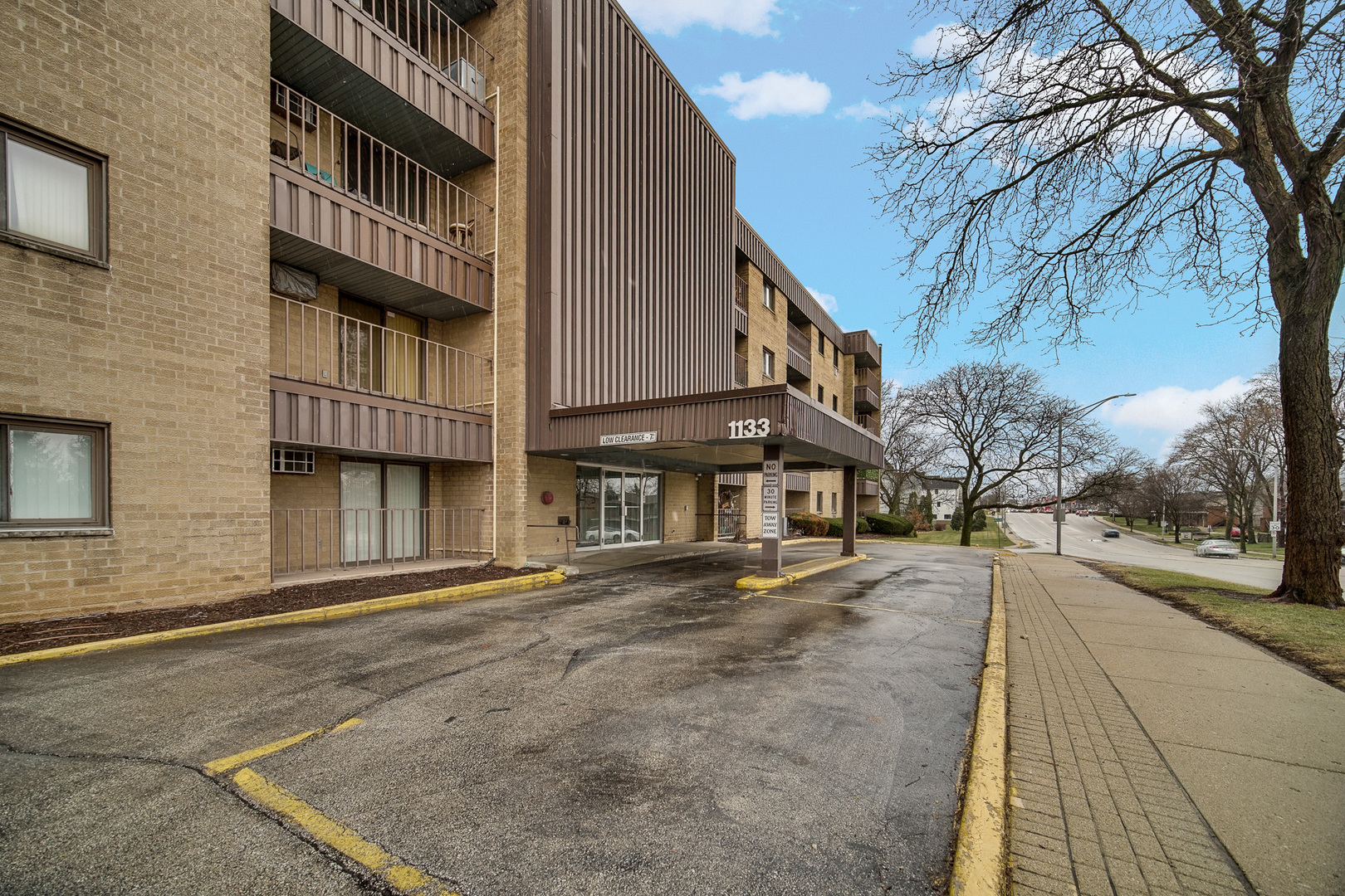 1133 South Finley Road, Unit 310 Lombard, IL 60148 - Photo 3 of 22 a city street lined with tall buildings