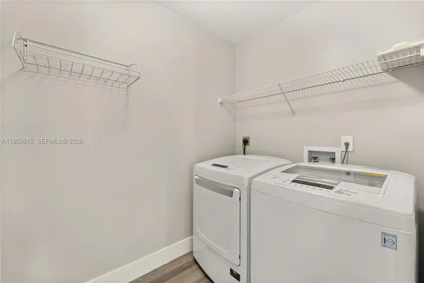 a utility room with dryer and washer