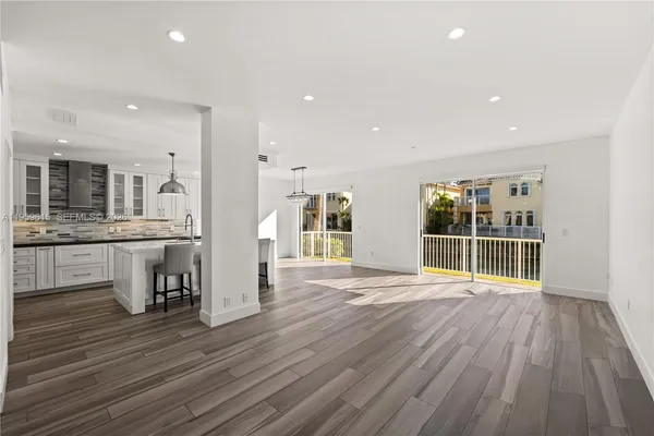 a view of kitchen with cabinets and outdoor space