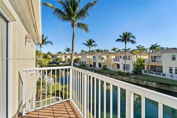 a view of a balcony with potted plants