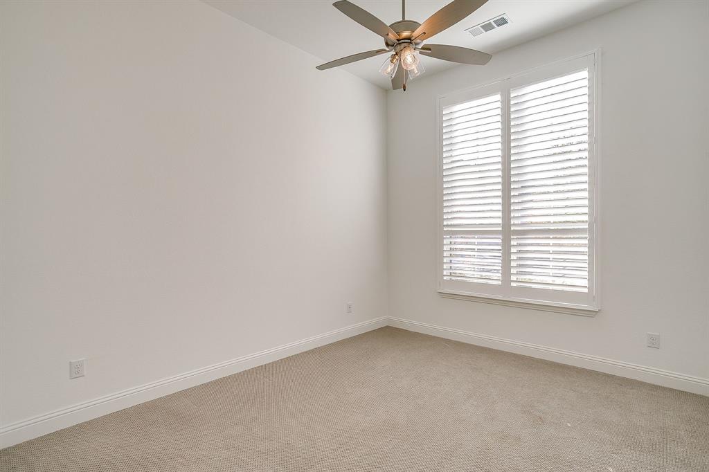 14328 Capridge Road Fort Worth, TX 76008 - Photo 15 of 39 an empty room with a window and a fan
