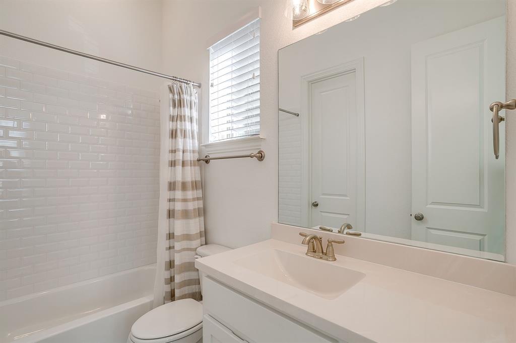 14328 Capridge Road Fort Worth, TX 76008 - Photo 16 of 39 a bathroom with a sink toilet and shower