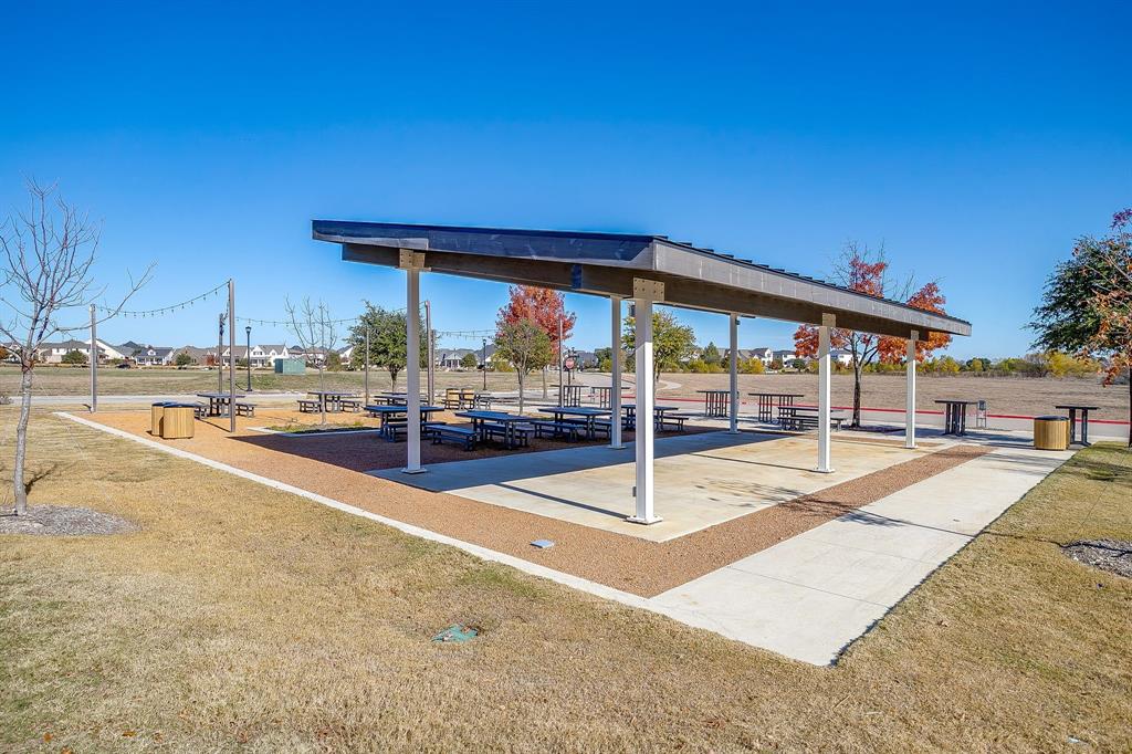 14328 Capridge Road Fort Worth, TX 76008 - Photo 36 of 39 a view of a house with a backyard patio and swimming pool