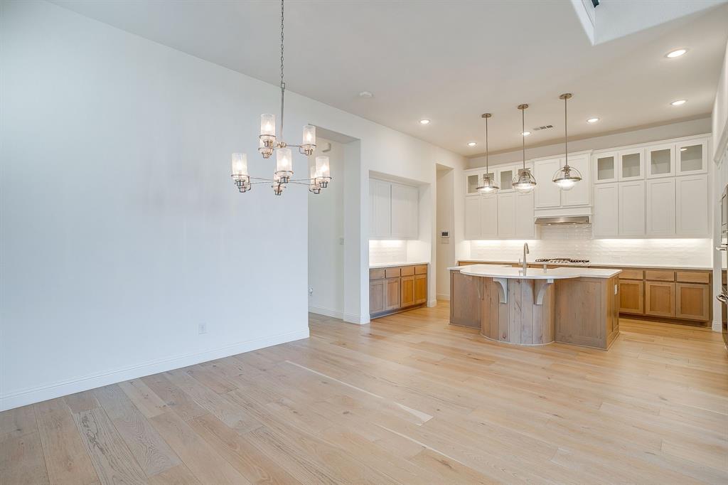 14328 Capridge Road Fort Worth, TX 76008 - Photo 6 of 39 a view of kitchen with granite countertop refrigerator and stove