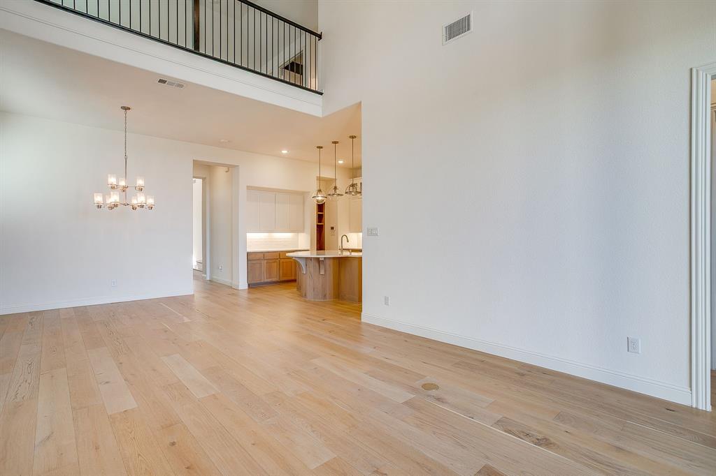 14328 Capridge Road Fort Worth, TX 76008 - Photo 10 of 39 a view of a livingroom with a kitchen