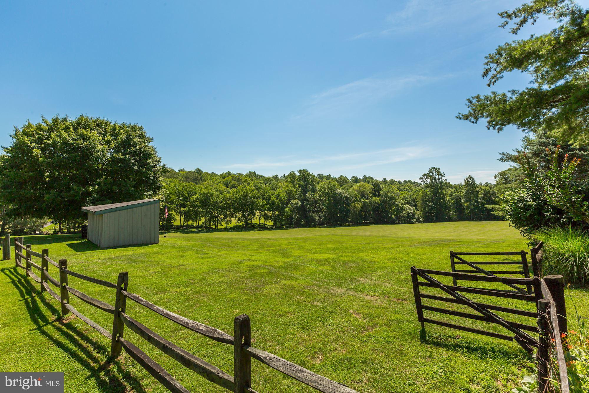 23009 Cobb House Road Middleburg, VA 20117 - Photo 48 of 50 Open pasture with fencing and run-in shed