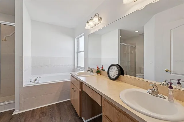 a bathroom with a granite countertop sink a toilet and mirror