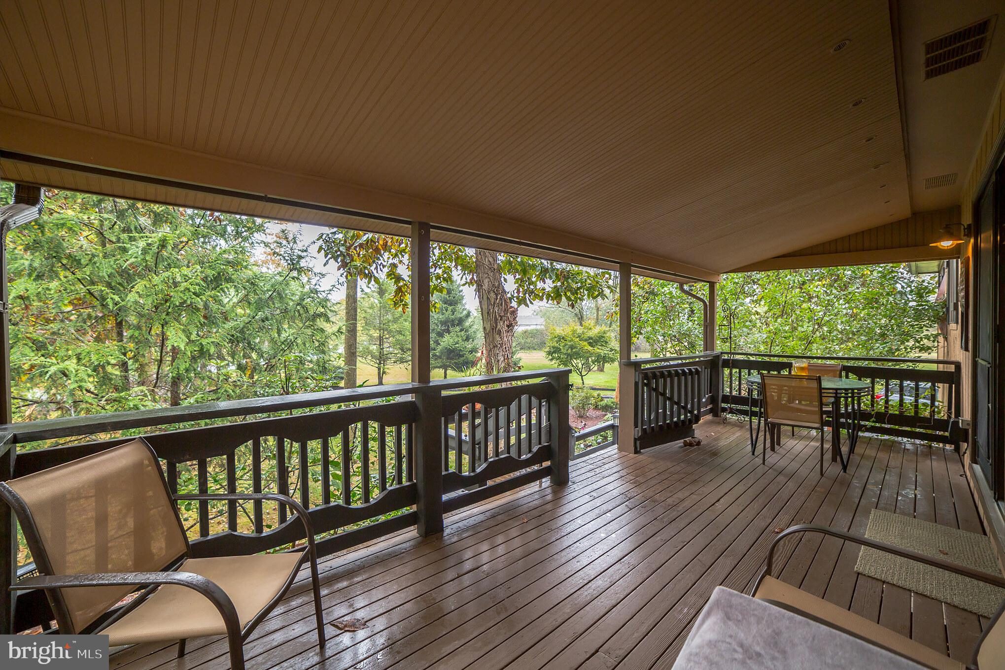 948 Callowhill Road Perkasie, PA 18944 - Photo 2 of 29 a view of a chairs and table in patio with wooden floor