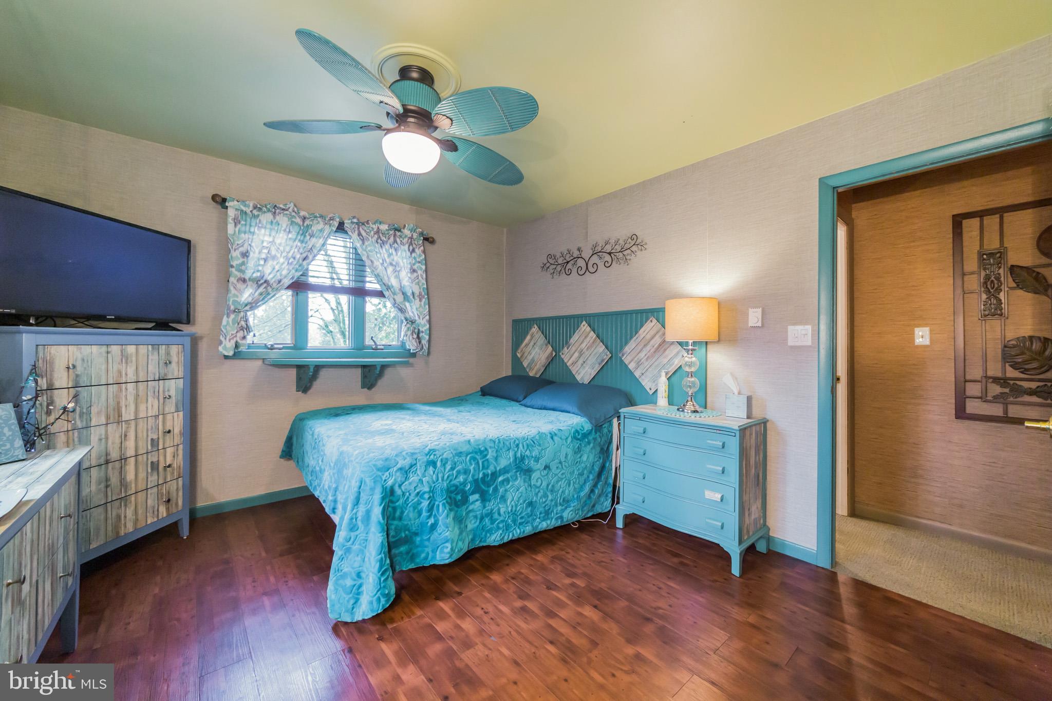 948 Callowhill Road Perkasie, PA 18944 - Photo 12 of 29 a bedroom with a bed and a chandelier