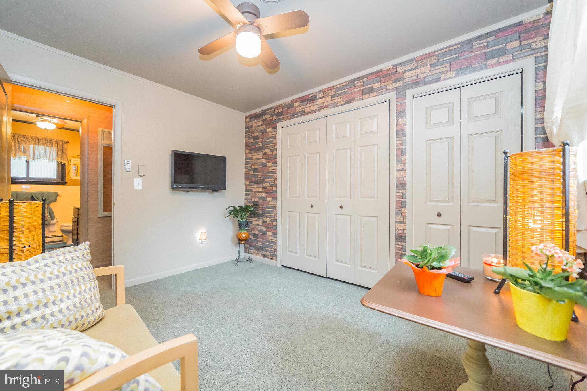948 Callowhill Road Perkasie, PA 18944 - Photo 15 of 29 a living room with furniture and a flat screen tv