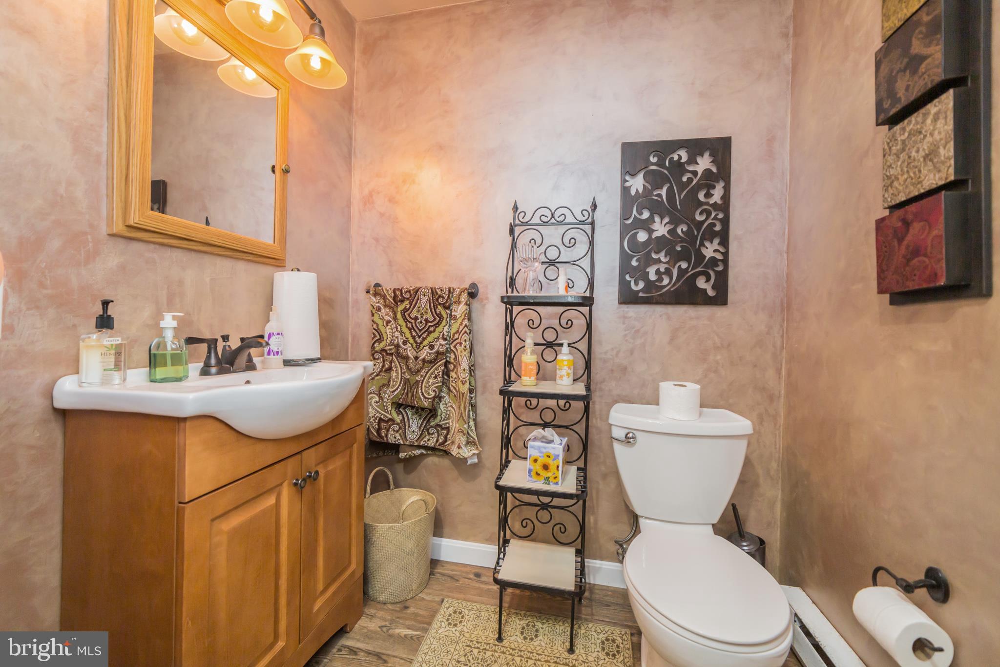 948 Callowhill Road Perkasie, PA 18944 - Photo 17 of 29 a bathroom with a toilet sink and mirror