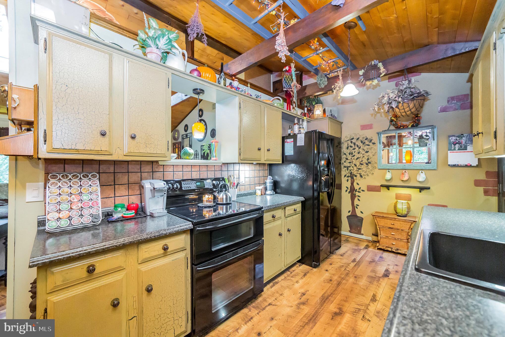 948 Callowhill Road Perkasie, PA 18944 - Photo 7 of 29 a kitchen with stainless steel appliances granite countertop a stove and cabinets