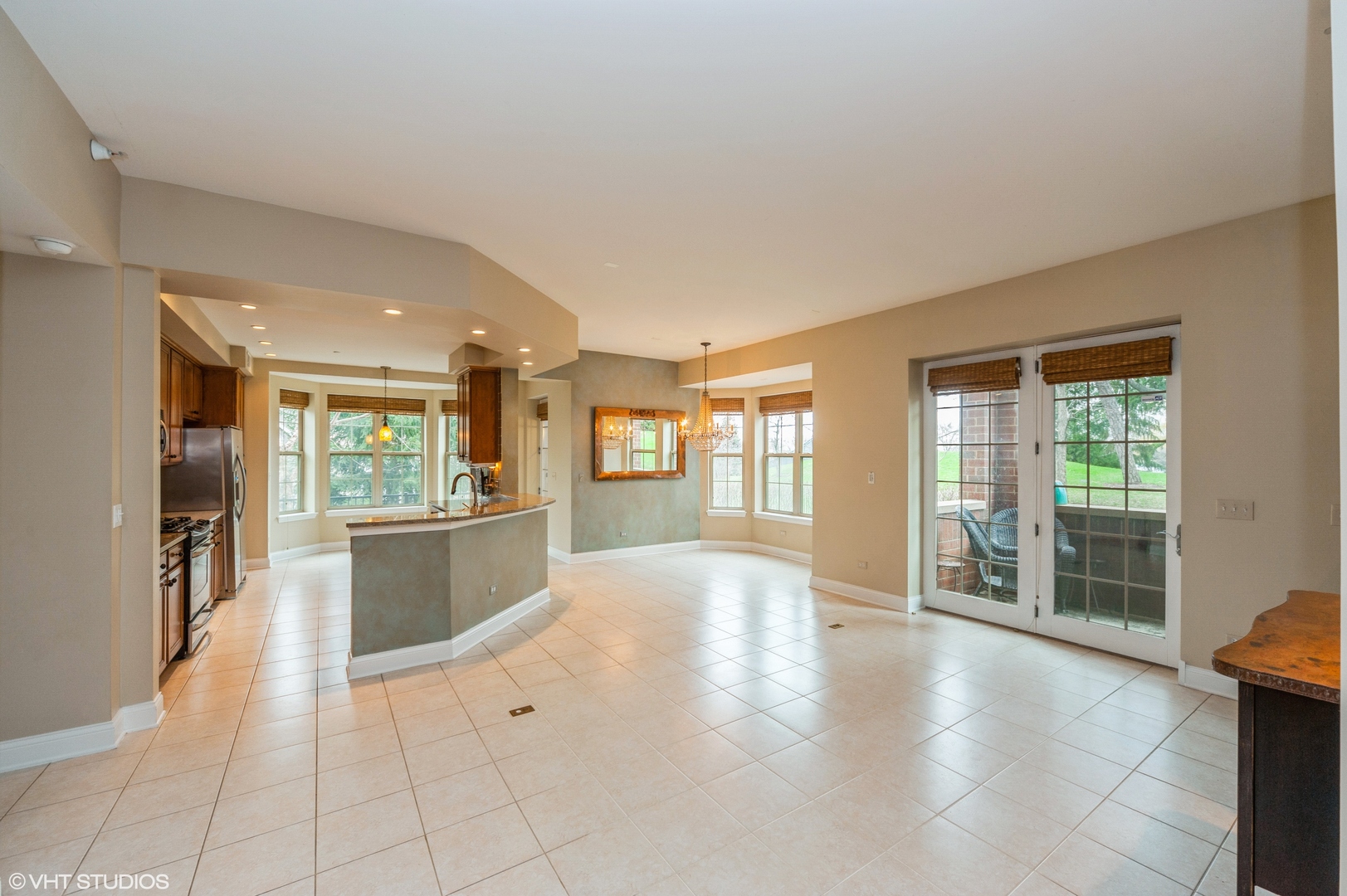 2700 Summit Drive, Unit 101 Glenview, IL 60025 - Photo 4 of 14 a large space with a large window and kitchen view