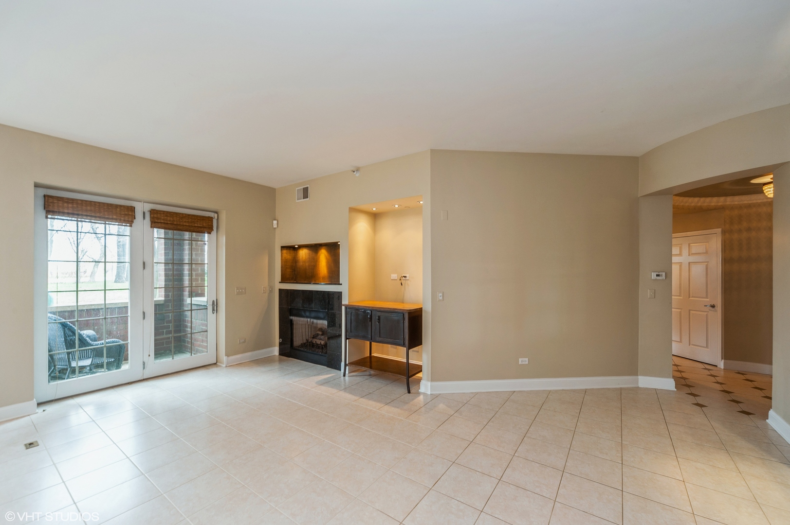 2700 Summit Drive, Unit 101 Glenview, IL 60025 - Photo 5 of 14 a view of an empty room with glass door and a window