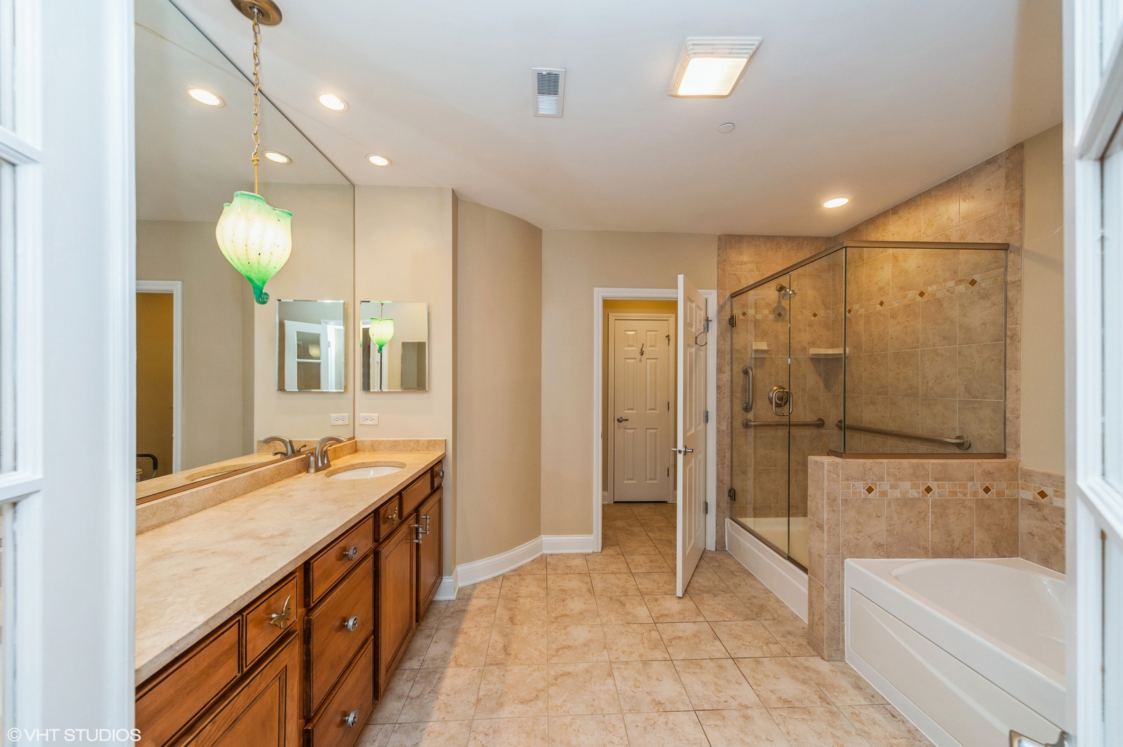 2700 Summit Drive, Unit 101 Glenview, IL 60025 - Photo 8 of 14 a bathroom with a tub sink shower and mirror