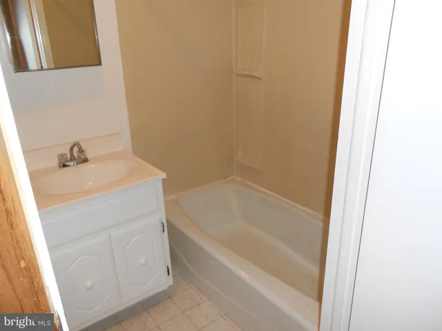 a bathroom with a sink and a bathtub