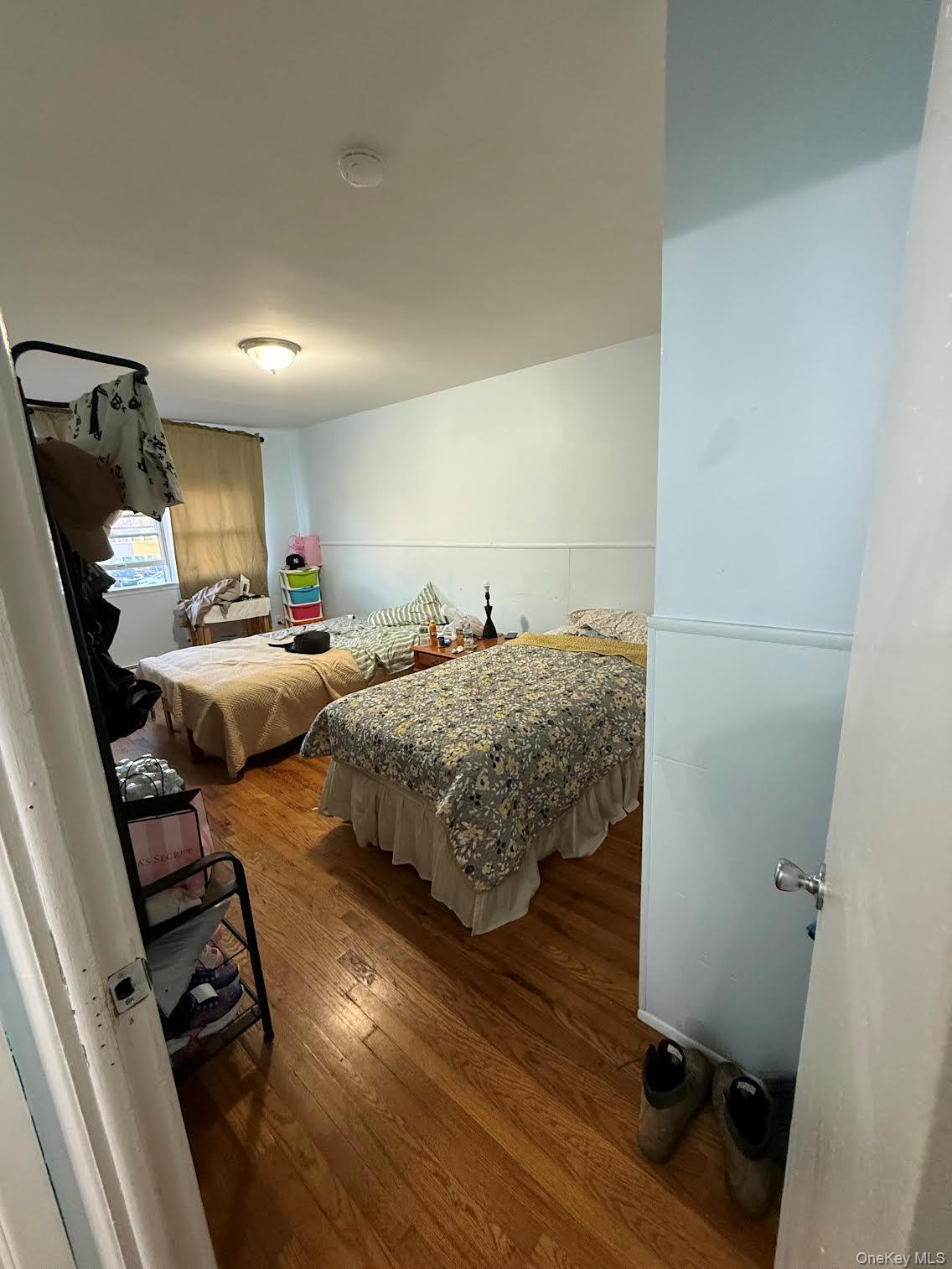 39 Coolidge Street Haverstraw, NY 10927 - Photo 11 of 13 a bedroom with furniture and a wooden floor