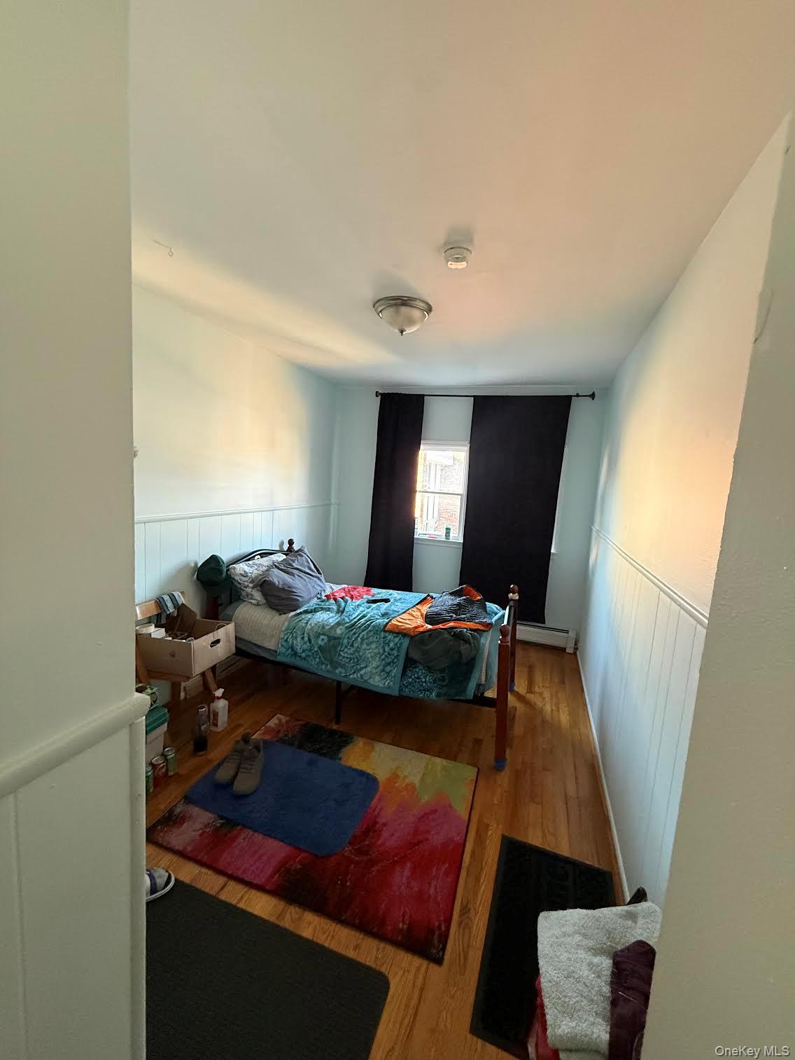 39 Coolidge Street Haverstraw, NY 10927 - Photo 12 of 13 a bedroom with a bed and a mirror