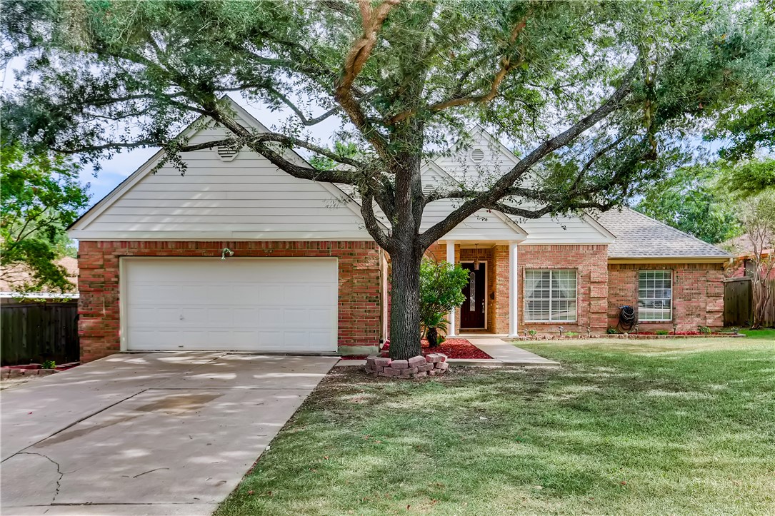 6505 Bramber Lane Austin, TX 78754 - Photo 1 of 1 a front view of a house with a yard and trees